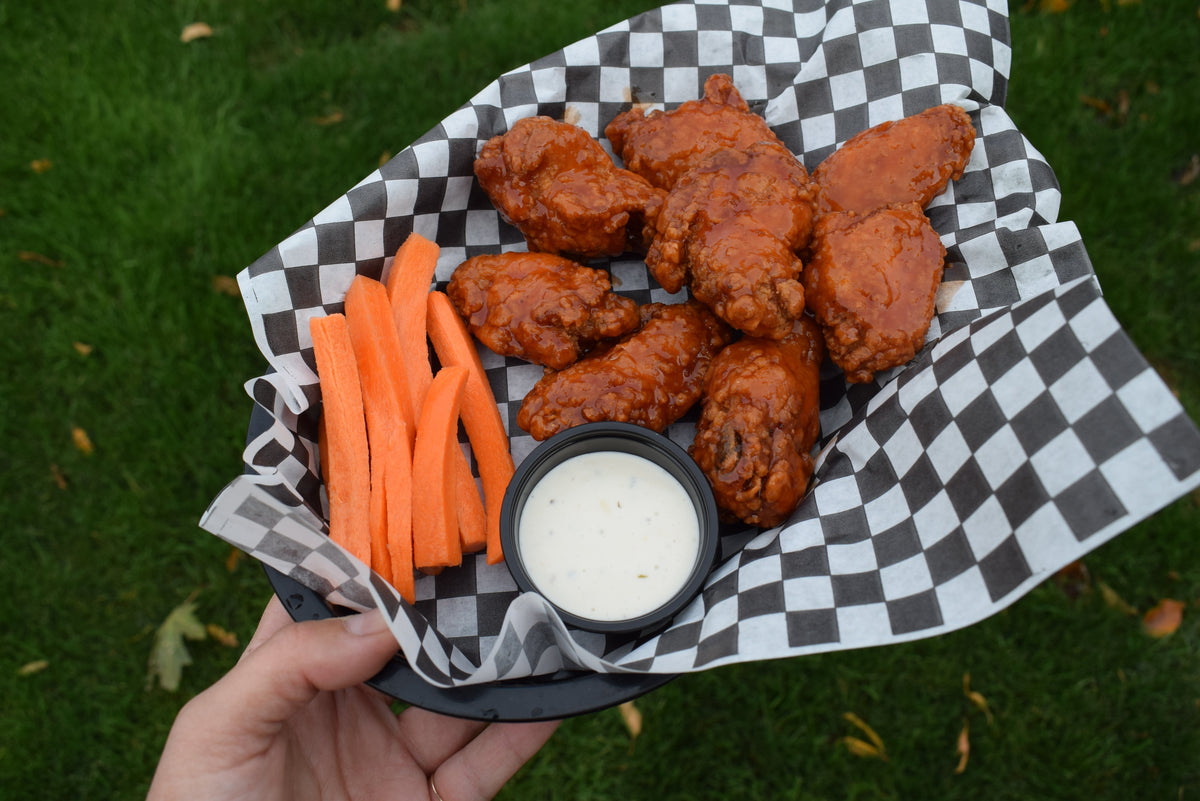 A basket of wings and vegetables from the Southern Pines kitchen
